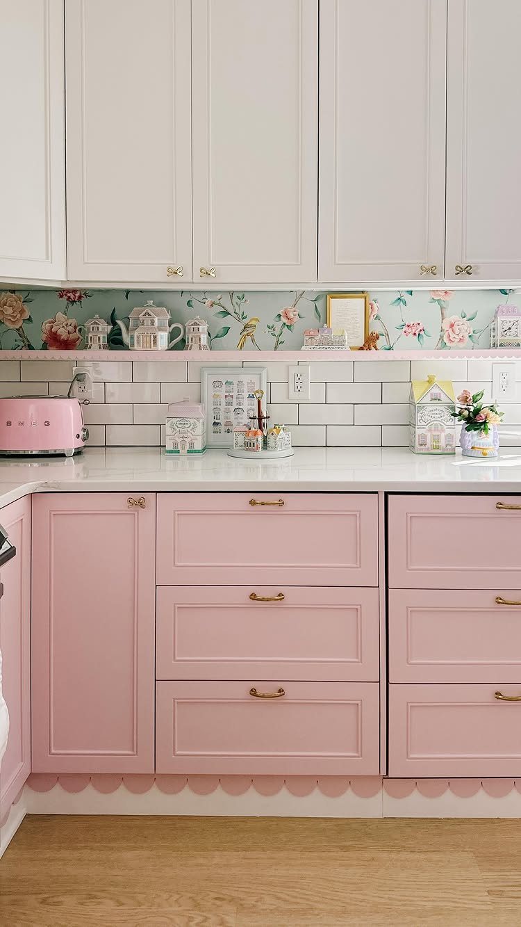 12 DIY Kitchen Makeover Ideas for Cabinets, Islands and Lighting 3 Pink and white kitchen cabinets with a floral backsplash and white subway tile.